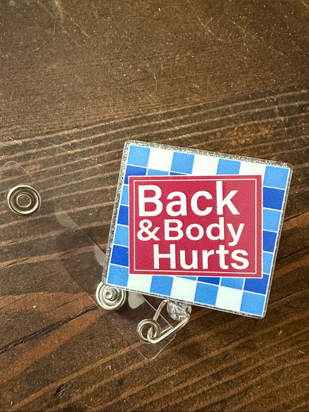 Back & Body Hurts Badge Reel - Blue and Red